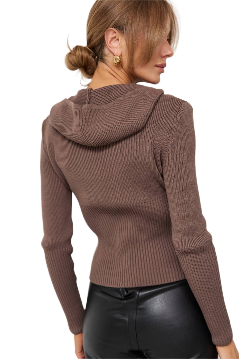 Brown ribbed sweater worn by a person on a white background