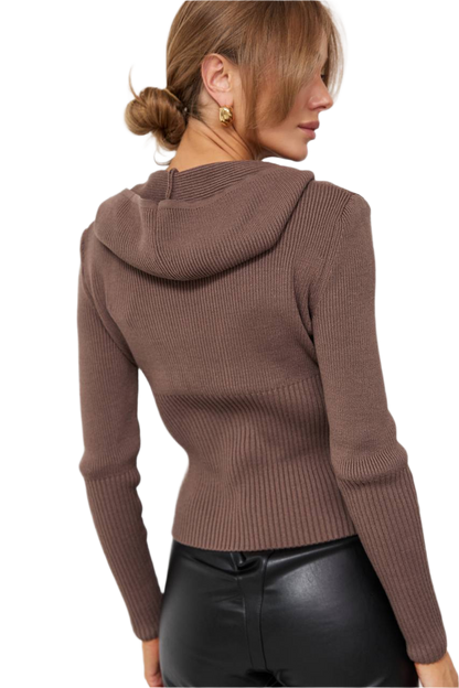 Brown ribbed sweater worn by a person on a white background