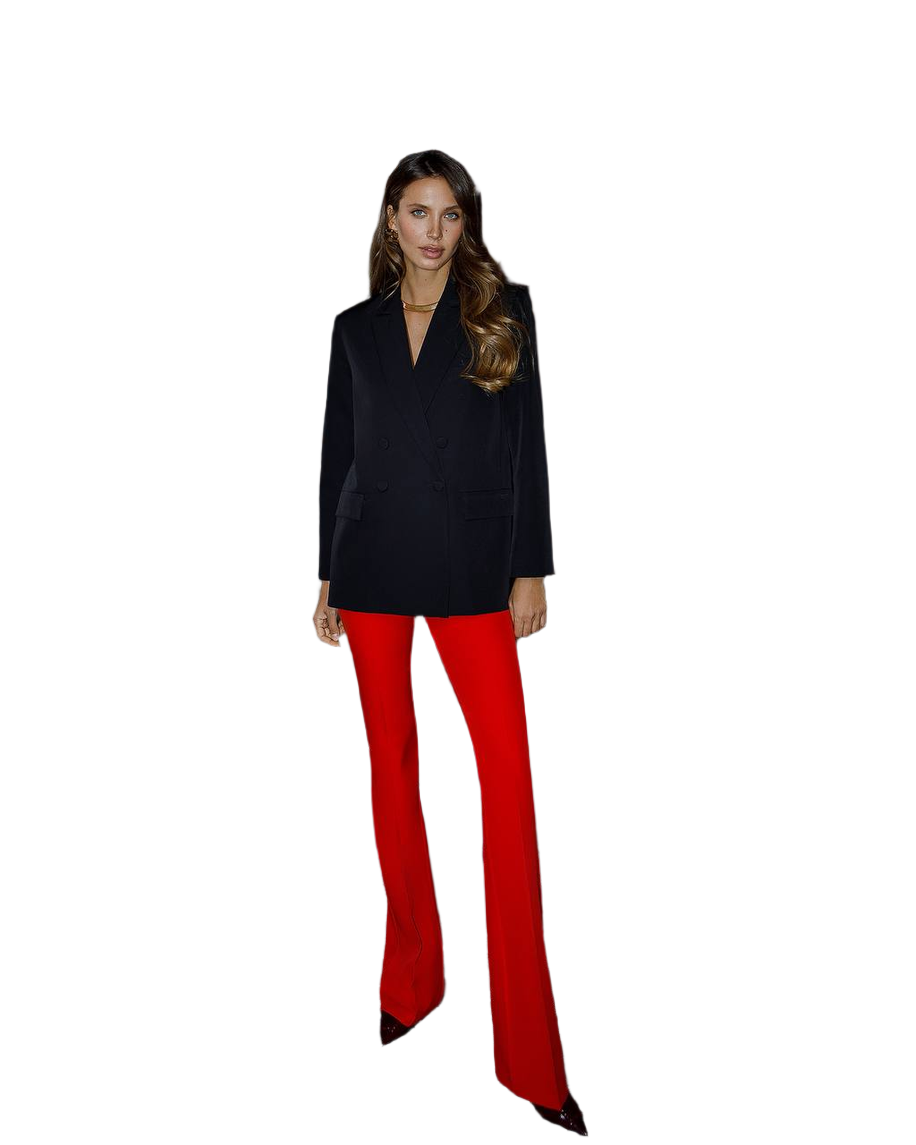 Woman wearing a black top and red pants on a white background