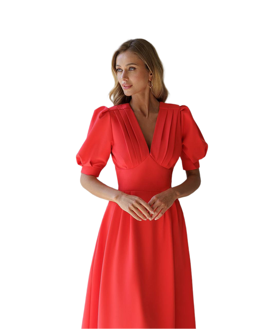 Woman wearing a red dress with puff sleeves on a white background