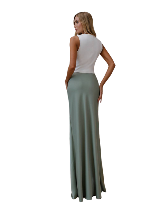 Woman wearing a white top and green skirt on a white background