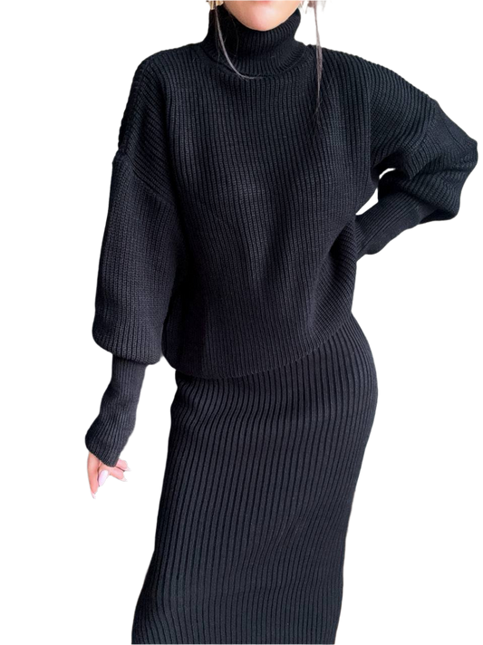 Person wearing a black ribbed knit outfit on a white background