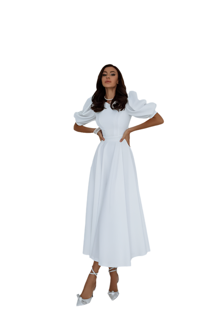 Woman wearing a white dress with puffed sleeves on a white background