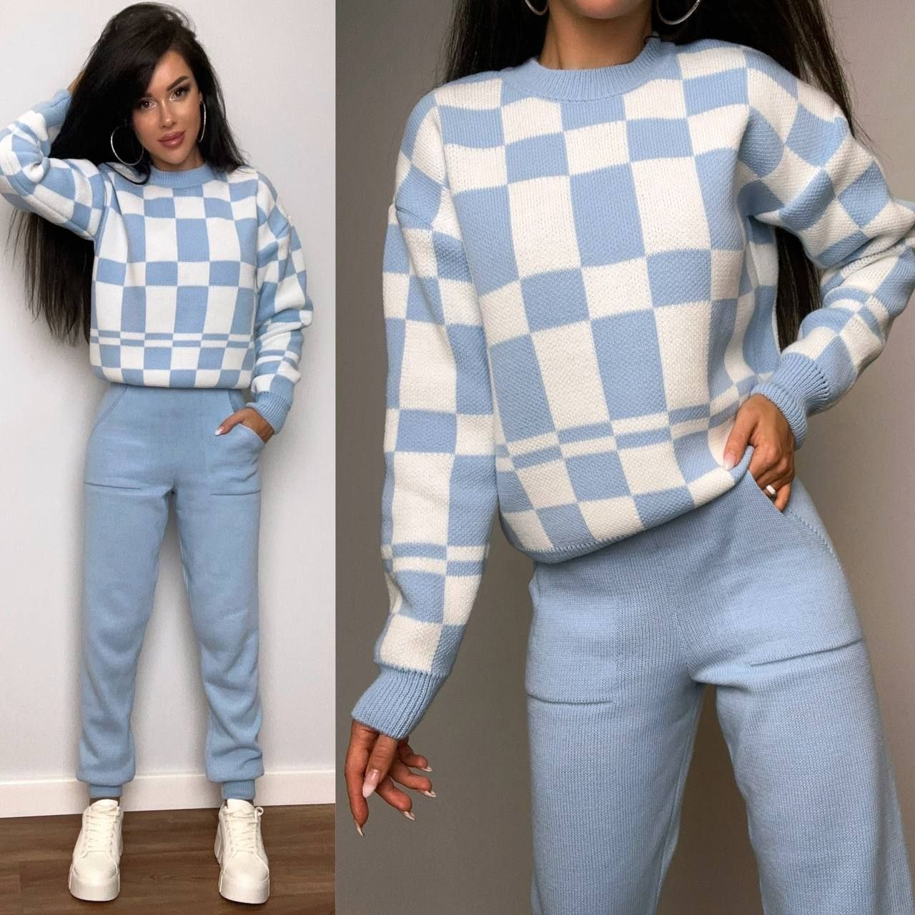 Woman wearing a blue and white checkered sweater and pants set against a neutral background.