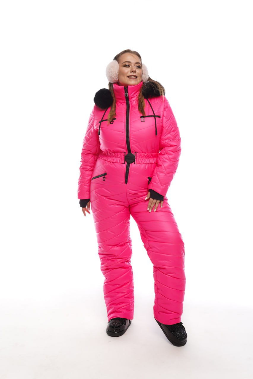 Person wearing a bright pink snowsuit with black accents on a white background
