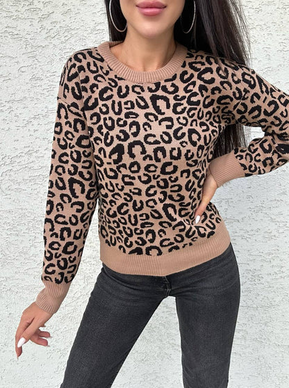 Person wearing a leopard print sweater against a light background