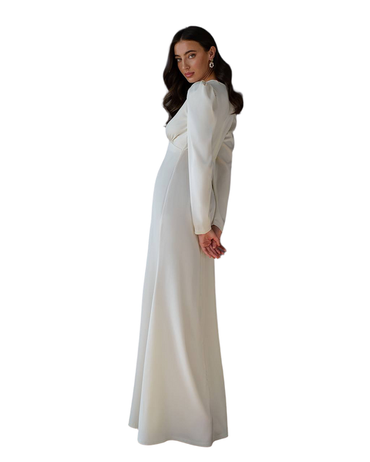 Woman wearing a long white dress on a white background