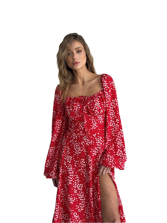 Woman wearing a red floral dress on a white background