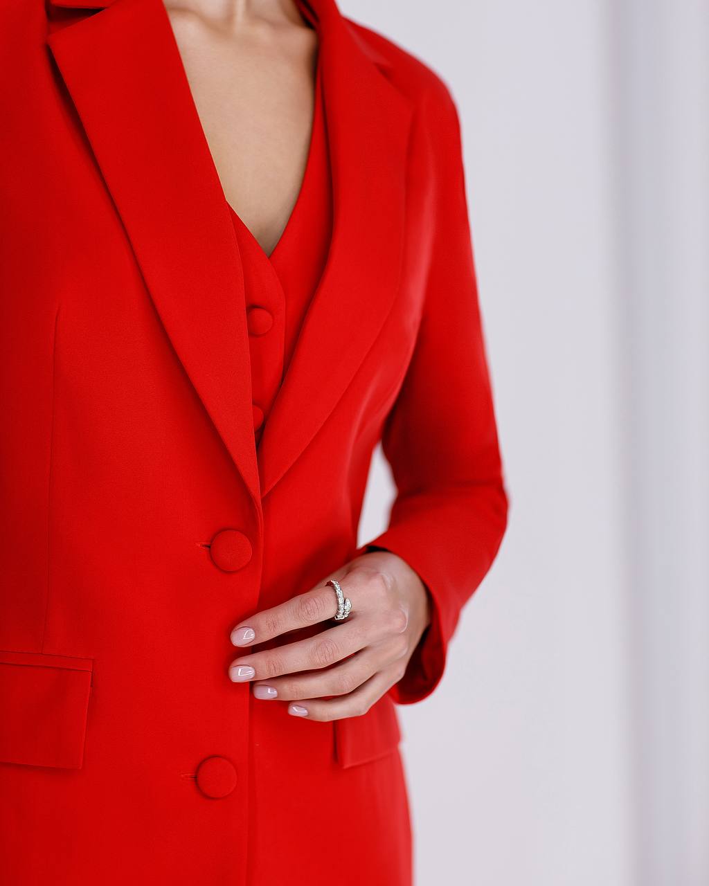 Red coat with a plain background