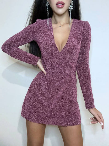 Purple glittery dress worn by a model on a white background