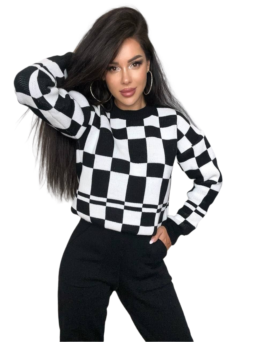 Person wearing a black and white checkered sweater on a white background
