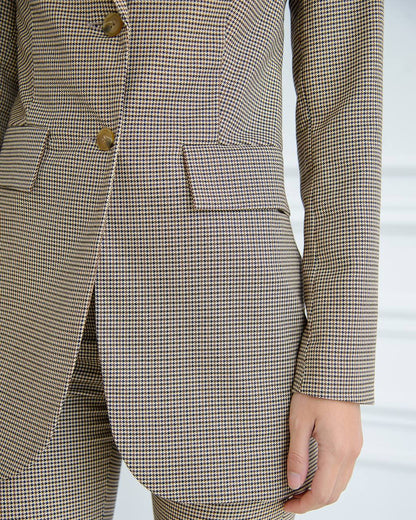 Houndstooth patterned suit jacket and pants on a white background