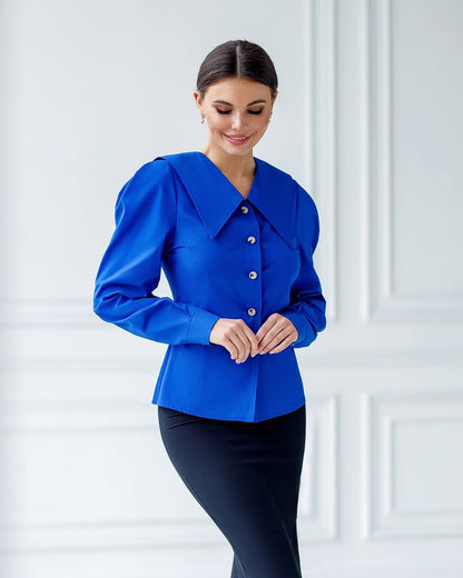 Woman wearing a blue blouse with a white background