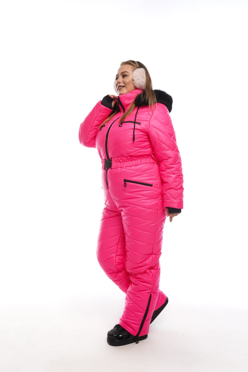 Person wearing a bright pink puffer suit on a white background