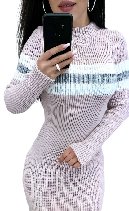 Person wearing a light purple ribbed knit dress with a white stripe, holding a phone.