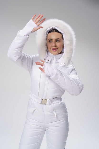 Person wearing a white winter outfit with a fur-lined hood on a gray background
