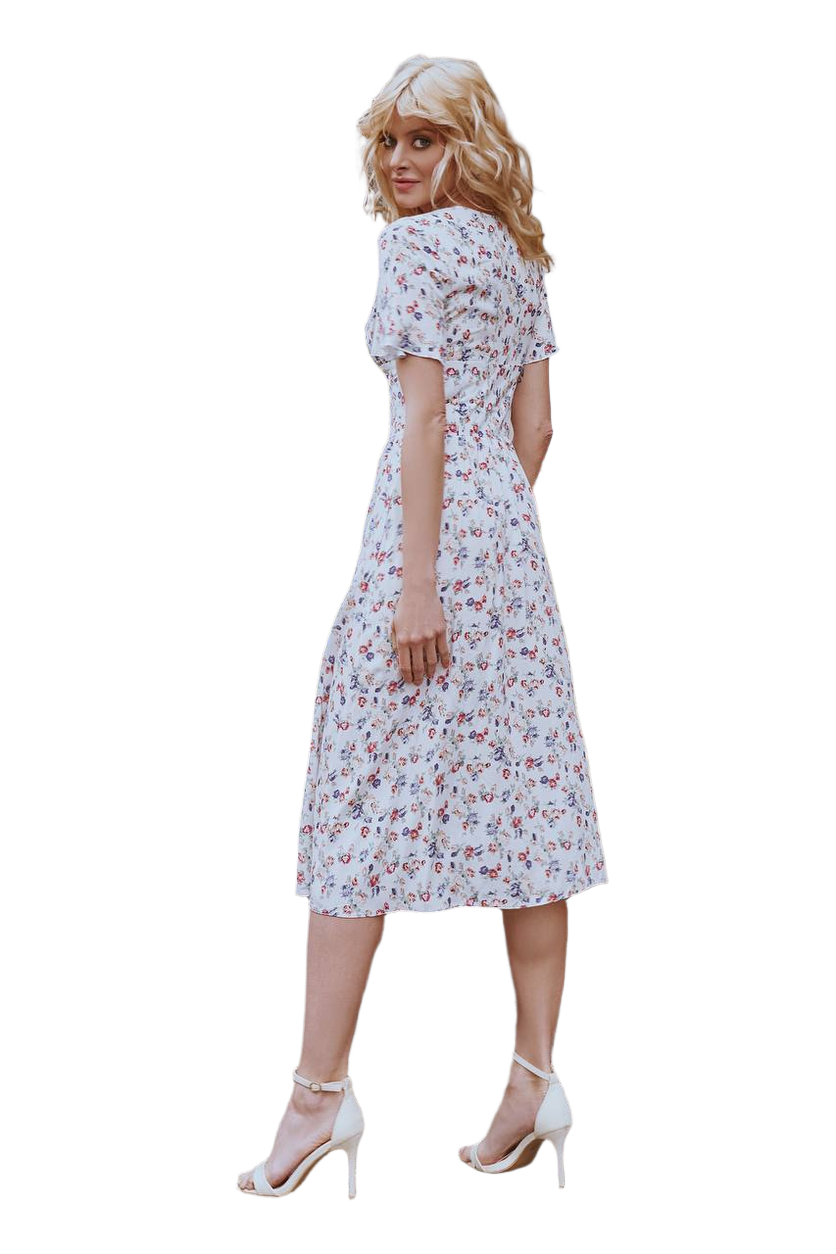 Woman wearing a floral dress on a white background