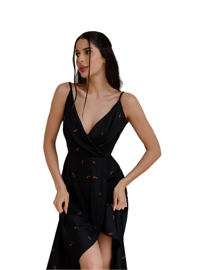Woman wearing a black dress with red patterns on a white background