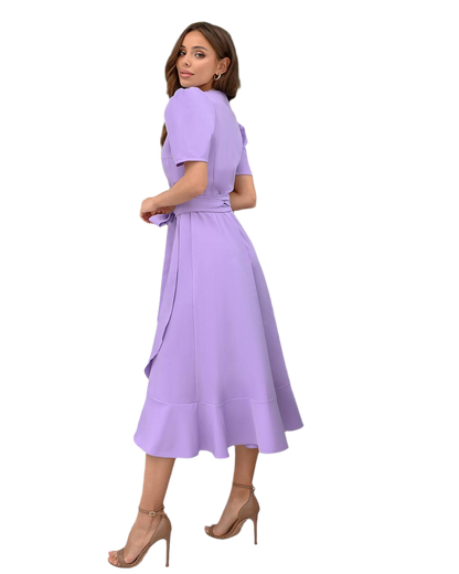 Woman wearing a purple dress on a white background