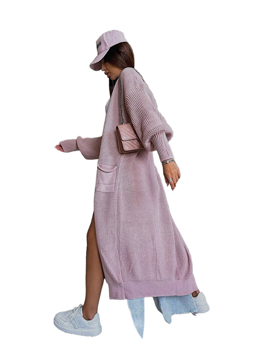 Person wearing a long pink cardigan with a white background