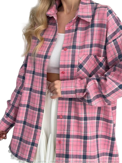 Person wearing a pink and blue plaid shirt with a white background