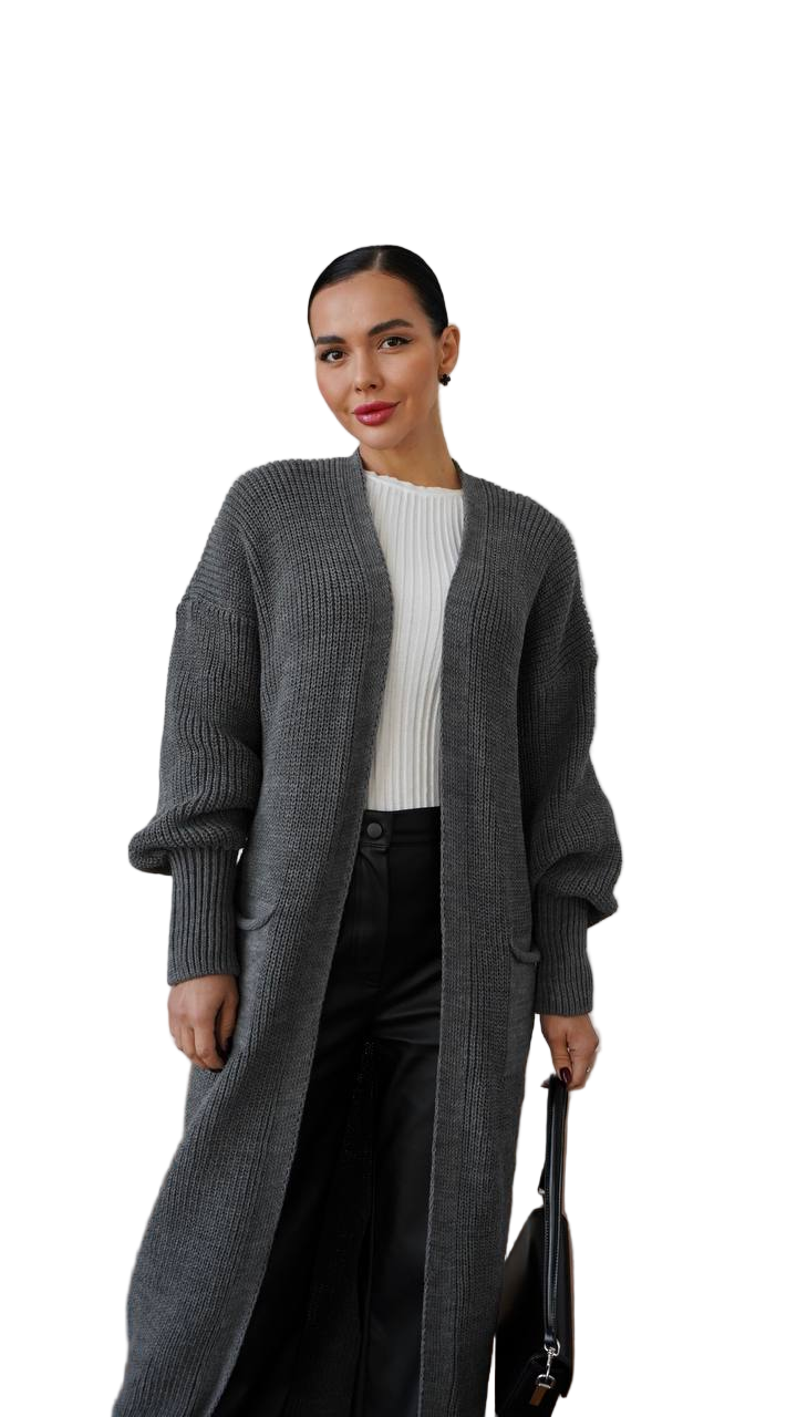 Woman wearing a long gray cardigan over a white top on a white background