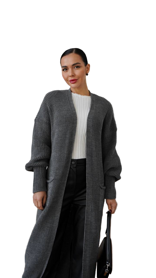 Woman wearing a long gray cardigan over a white top on a white background