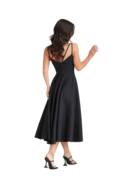 Woman wearing a black dress on a white background