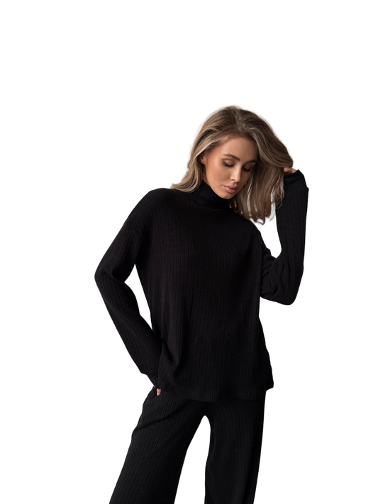 Woman wearing a black outfit on a white background