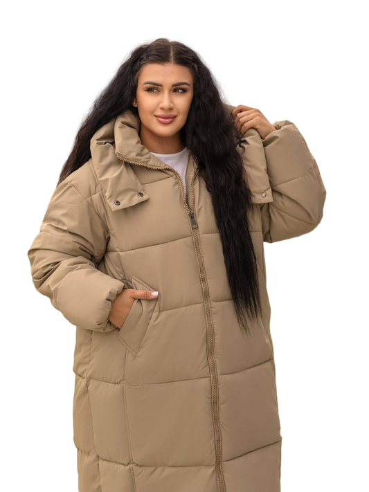 Woman wearing a beige puffer coat on a white background