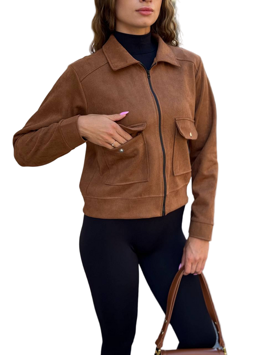 Woman wearing a brown suede jacket on a white background