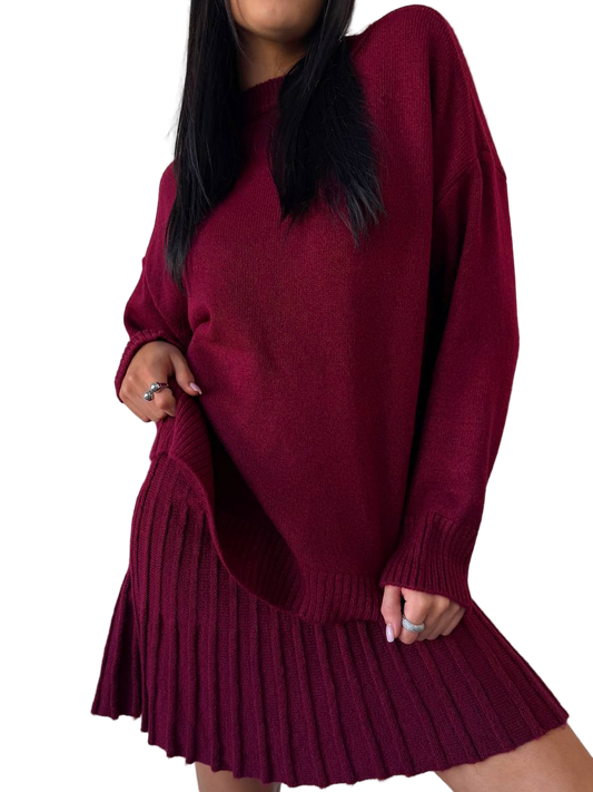 Maroon sweater dress worn by a person on a white background