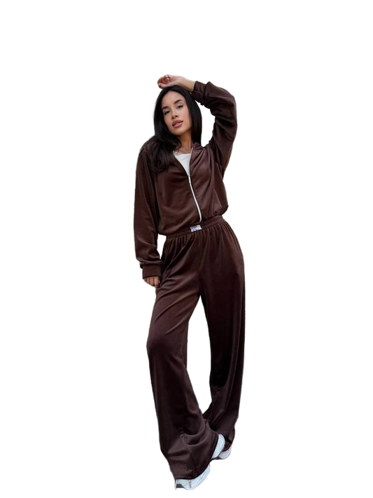Person wearing a brown tracksuit on a white background