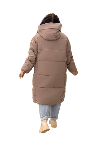 Person wearing a long brown puffer coat on a white background