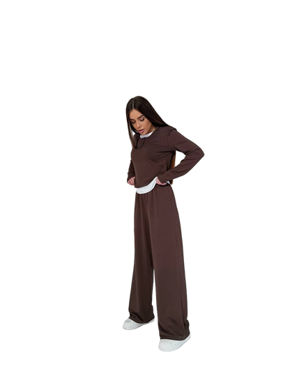 Person wearing a brown nun costume on a white background