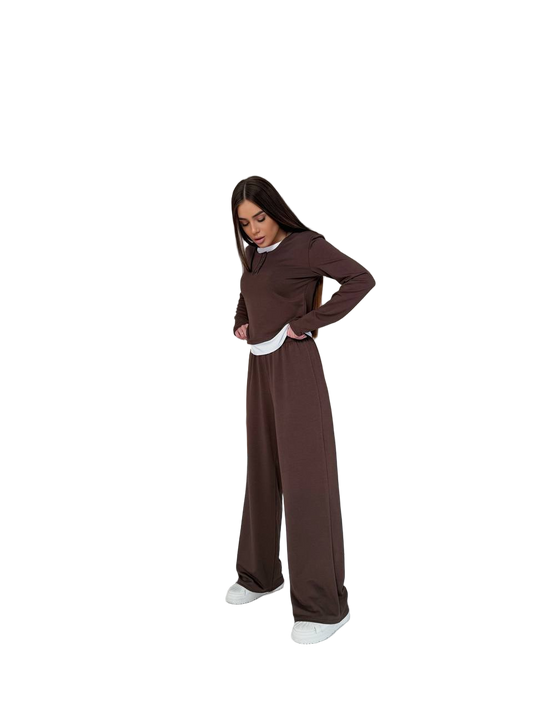 Person wearing a brown nun costume on a white background