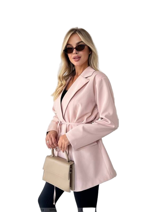 Woman wearing a pink coat and sunglasses, holding a beige handbag on a white background