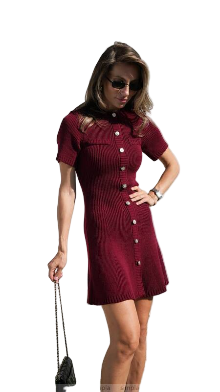 Woman wearing a red dress with white buttons on a white background