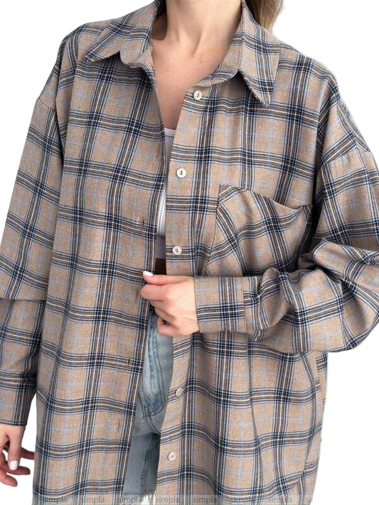 Plaid shirt worn by a person on a white background