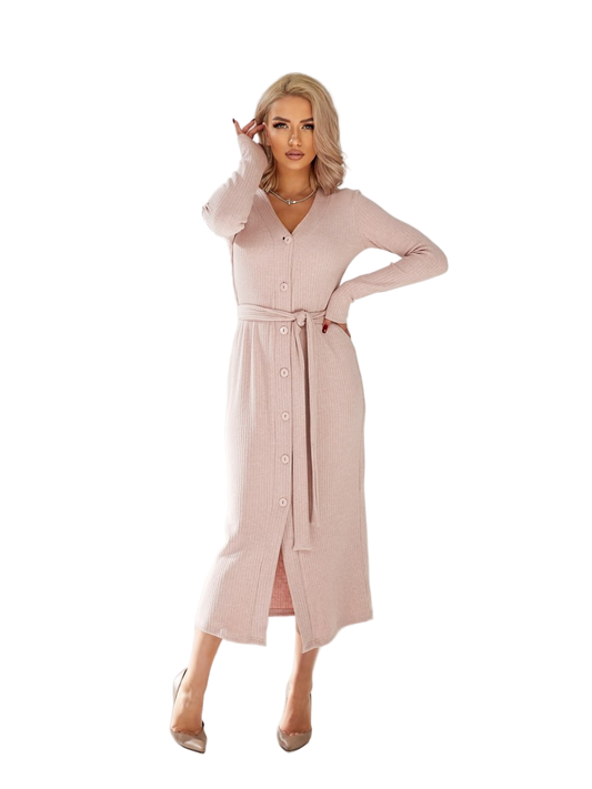 Woman wearing a long light pink dress on a white background