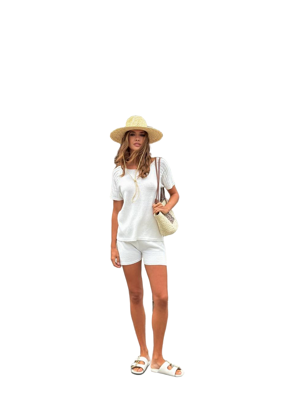 Woman in a white outfit with a hat and sandals on a white background