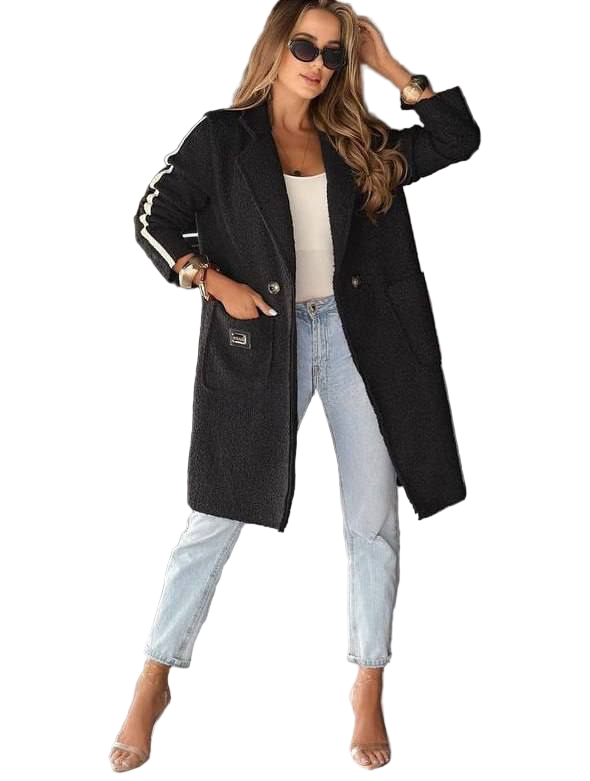 Woman wearing a black coat, white top, and light blue jeans on a white background