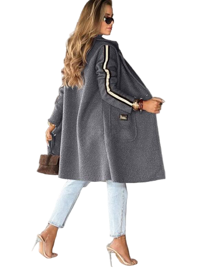 Woman wearing a gray coat with white trim on a white background