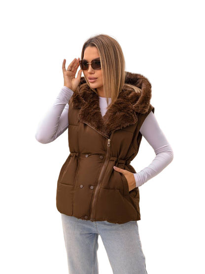 Woman wearing a brown puffer vest with fur trim on a white background