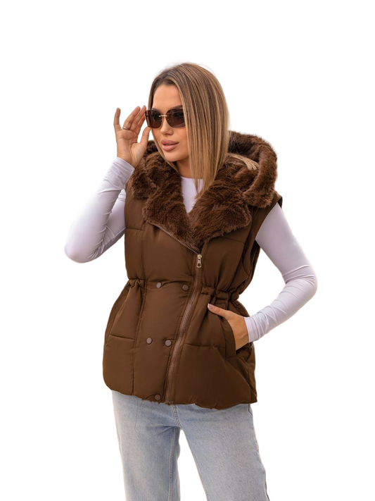 Woman wearing a brown puffer vest with fur trim on a white background