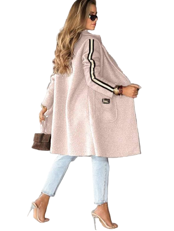 Woman wearing a light pink coat with black stripes on a white background