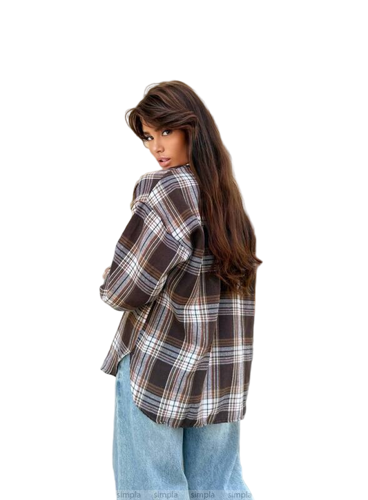 Woman wearing a plaid shirt and jeans on a white background