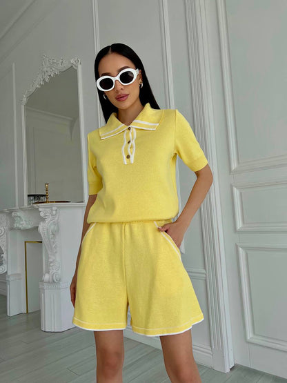 Woman wearing a yellow outfit with a white background