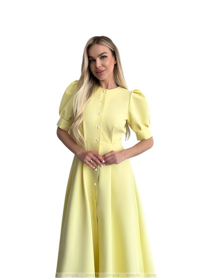 Woman wearing a yellow dress on a white background