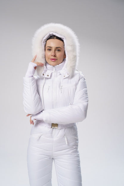 Person wearing a white winter outfit with a fur-lined hood on a gray background